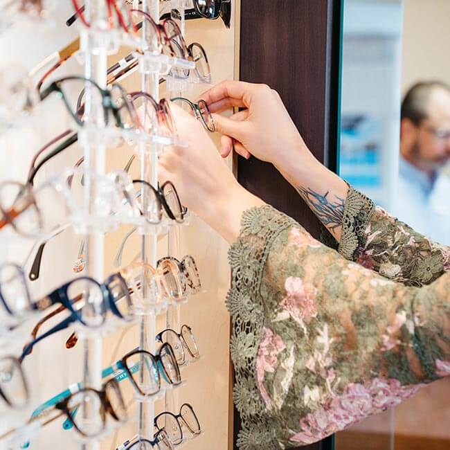 arranging eyeglasses collection at True Eye Experts