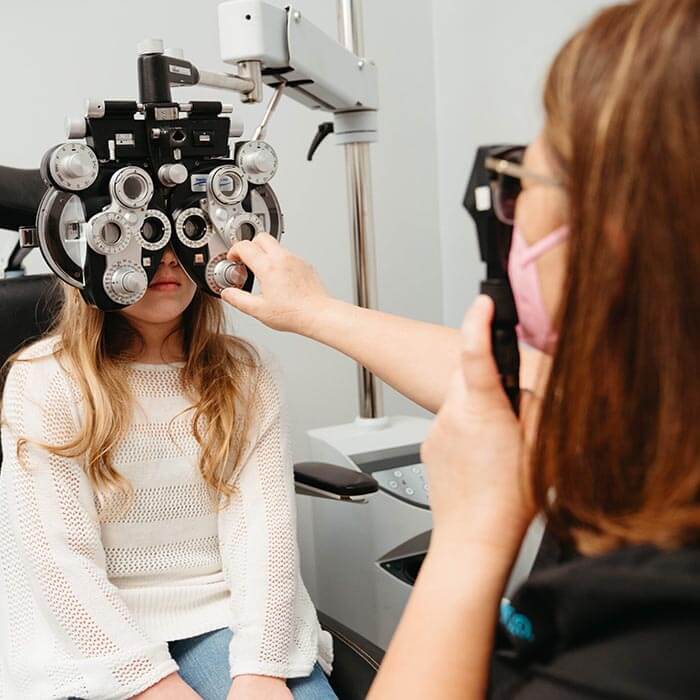 child taking eye exam at True Eye Experts