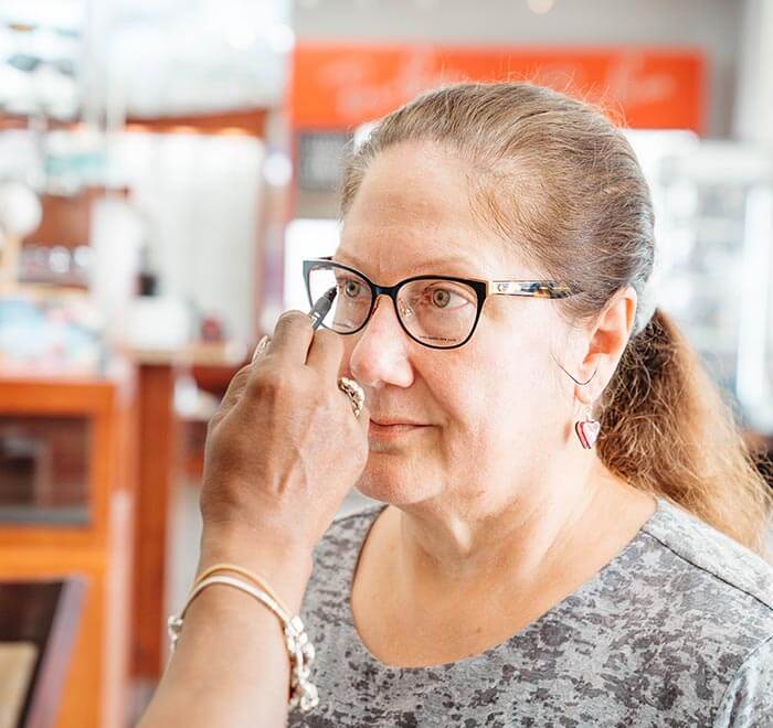 beautiful woman happy with her glasses at True Eye Experts