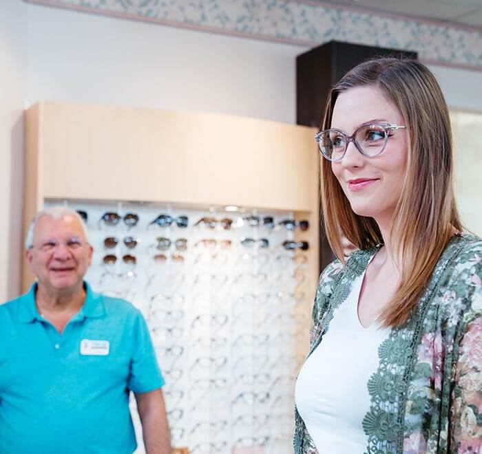 woman happy with designer eyewear at True Eye Experts
